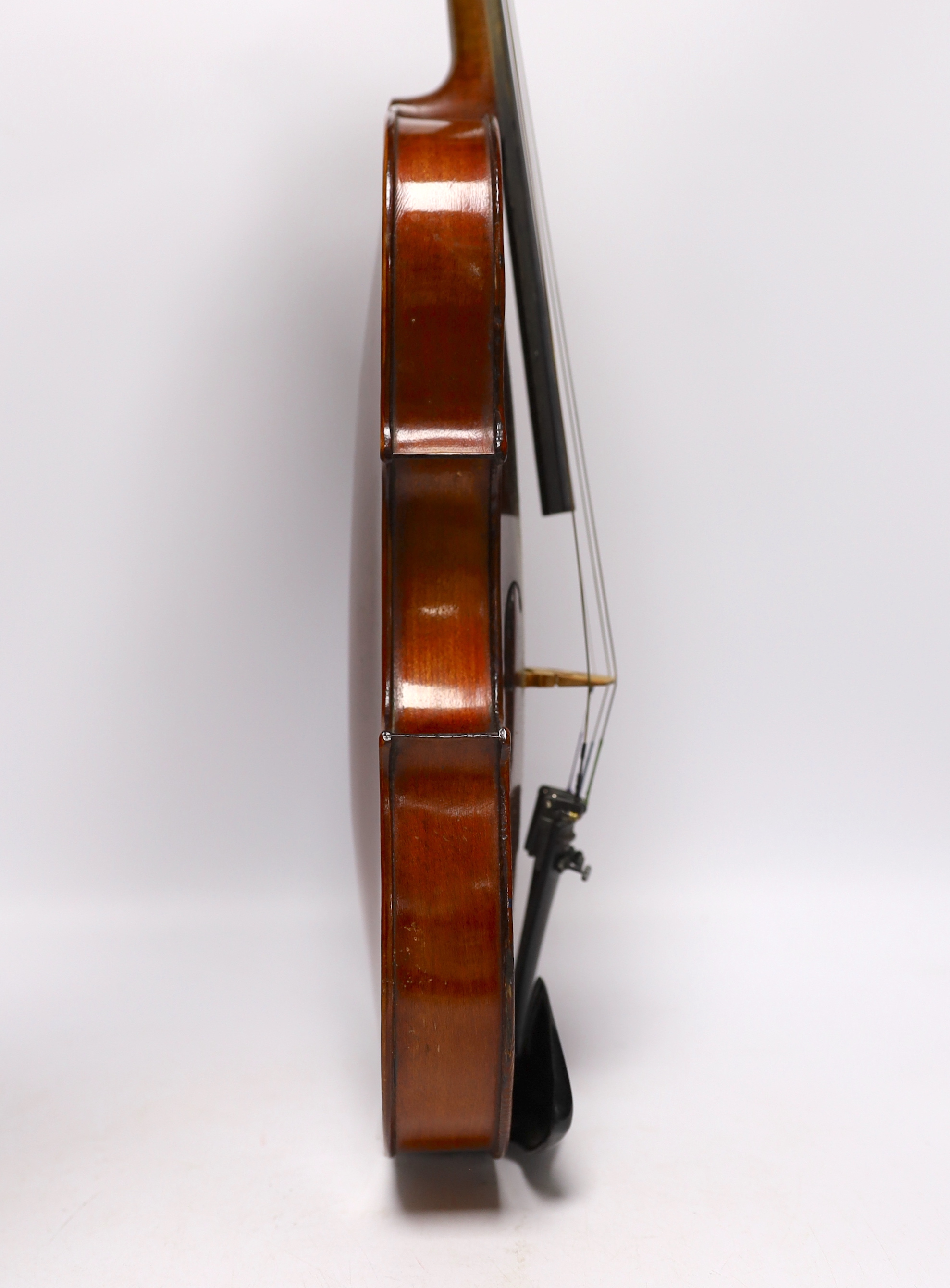 A wooden cased student violin